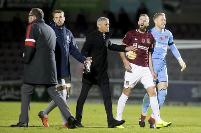 Dave Artell confronted Kevin van Veen at full-time before Keith Curle pulled his striker away. Picture: Kirsty Edmonds