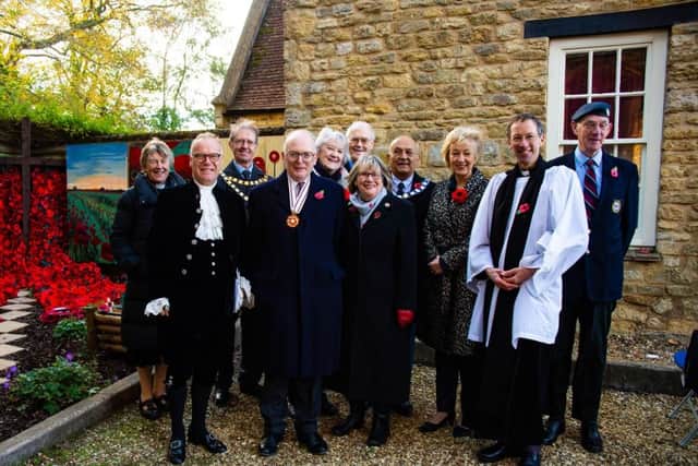 Rev Lulu Pelly, Hon J M R Saunders Watson (High Sheriff of Northamptonshire), Richard Dallyn (chairman of SNC), Stuart Richmond-Watson (Deputy Lieutenant of Northamptonshire) Eileen Reid (president of Towcester Evening WI), David Reed (RBL poppy appeal organiser), Sue Hamilton (Towcester Evening WI), Peter Conquest (Towcester Mayor), Rt Hon Andrea Leadsom MP, Rev Ben Phillips and Peter Stratton (deputy chairman RBL)