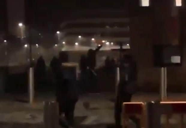 A student captured one of the fireworks being thrown into a group of people.