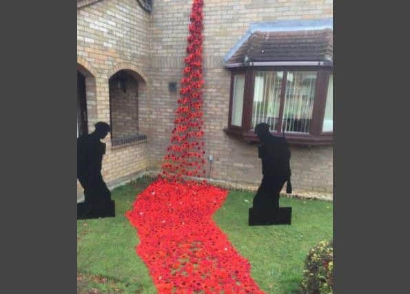 Friends and neighbours made about 2,000 poppies for Dawn Dyer's display at her East Hunsbury house