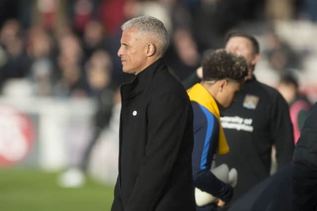 Keith Curle watches on from his dugout during Saturday's topsy-turvy FA Cup tie. Picture: Kirsty Edmonds