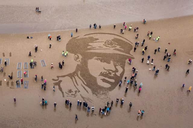 A sand portrait of Walter Tull has been drawn in Scotland as he is remembered 100 years on. Credit: SWNS.