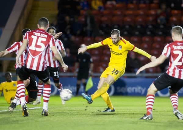 Kevin van Veen scores for the Cobblers at Lincoln on Saturday (Pictures: Kirty Edmonds)