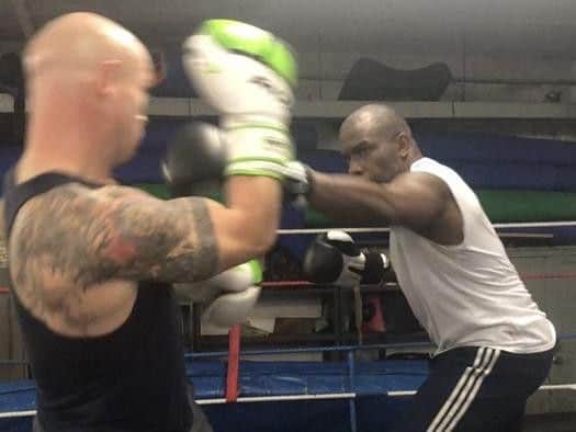 Olympic champion Derek Redmond has made the switch from the athletics track to the boxing ring.