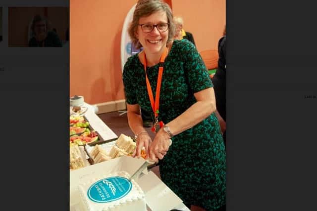 Sandra Adcock from Northamptonshire Healthcare Charitable Trust, the hospitals charity, cuts the celebration cake