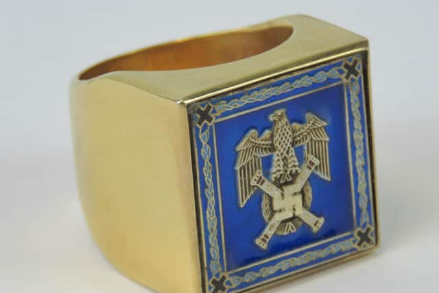 The ring is fitted with a blue enamelled seal with the Nazi emblem on it.