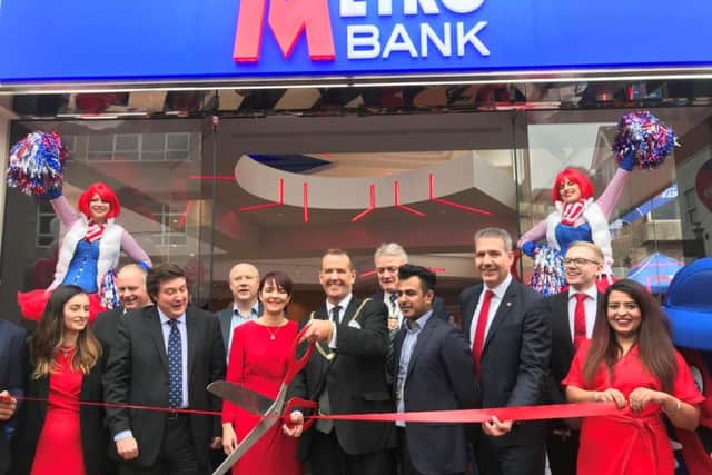 The ribbon-cutting ceremony in Abington Street featured a DJ and showgirls on stilts.