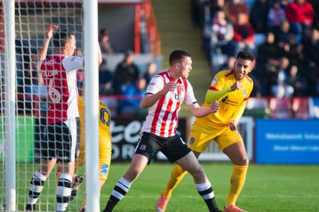 SCRAPPY: Daniel Powell celebrates after Billy Waters bundles the ball home to pull Town level with Exeter during the first-half on Saturday. Pictures: Kirsty Edmonds