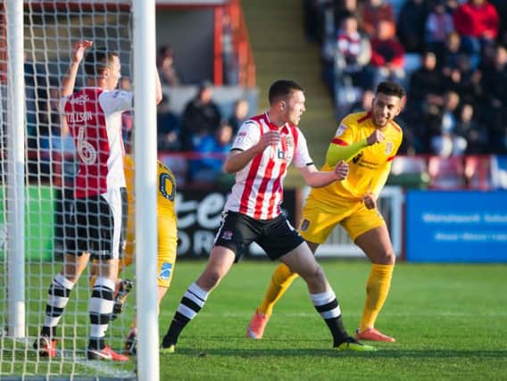 SCRAPPY: Daniel Powell celebrates after Billy Waters bundles the ball home to pull Town level with Exeter during the first-half on Saturday. Pictures: Kirsty Edmonds