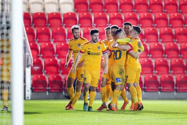 Cobblers celebrate Andy Williams' 'goal'. Picture: Kirsty Edmonds