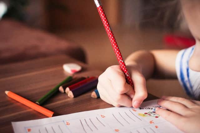 Image of child writing. Pixaby.