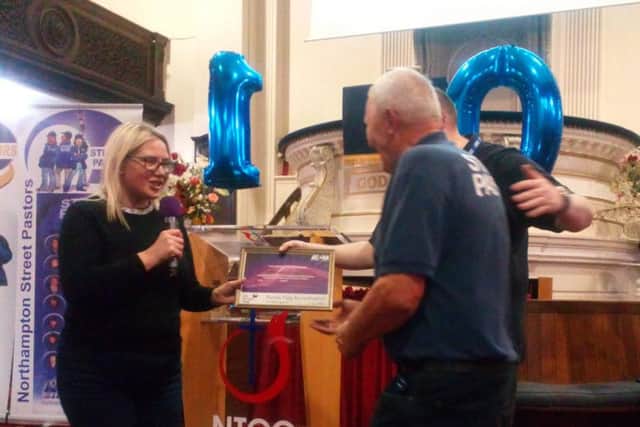Councillor Anna King presented the volunteer group with Northamptons Purple Flag Certificate at the New Testament Church of God.
