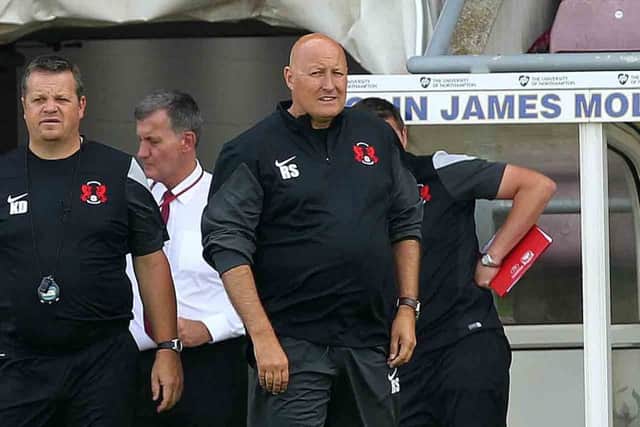 Russell Slade was sacked as Grimsby manager in March, replaced by current boss Michael Jolley