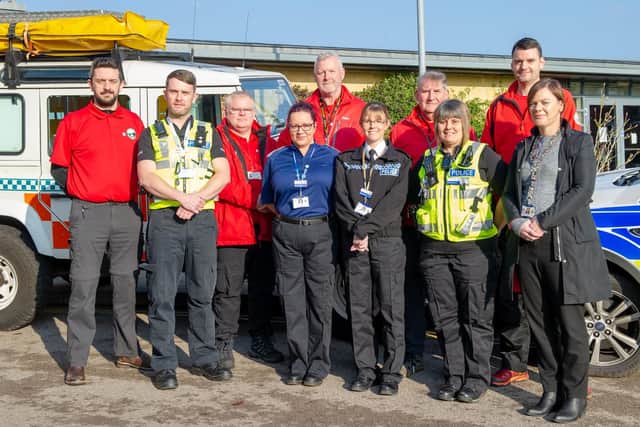 Volunteers of Northamptonshire Search and Rescue with police officers and control roomd staff at the launch of the Herbert Protocol