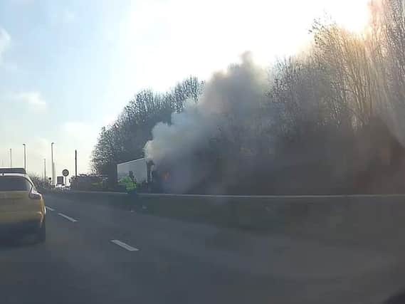 Dashcam footage shows smoke pouring from the lorry