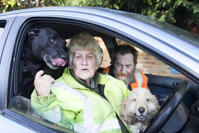 Jennifer Tysoe pictured with staffie Titan, her husband Nigel and cocker spaniel Becky. Picture: Kirsty Edmonds.
