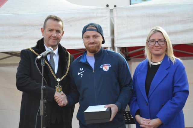 SANDS founder Robert Allen is presented the male role model of the year award by mayor of Northampton Councillor Tony Ansell, left, and Councillor Anna King, right.