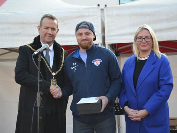 SANDS founder Robert Allen is presented the male role model of the year award by mayor of Northampton Councillor Tony Ansell, left, and Councillor Anna King, right.