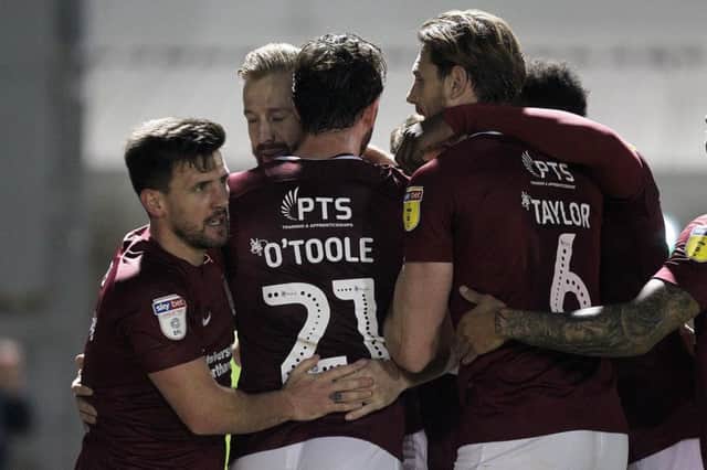 SHORT-LIVED: Cobblers celebrate Kevin van Veen's free-kick, but within minutes Grimsby hit back. Pictures: Sharon Lucey