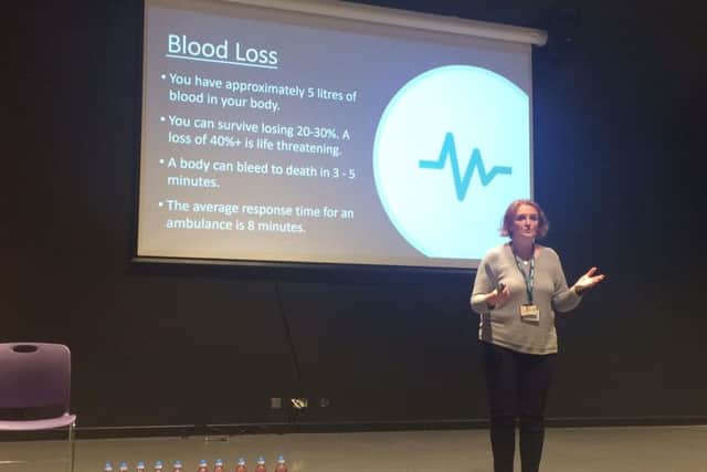 The talk used bottles of water to demonstrate how much blood is in a human body - and how little someone needs to lose to die.