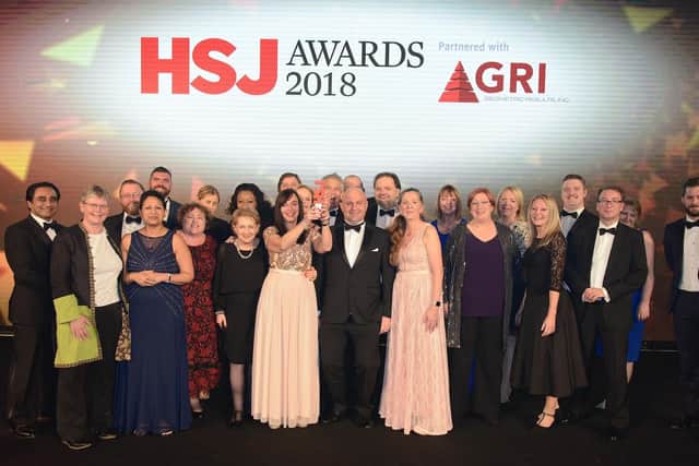 The executive team with their award on November 22.