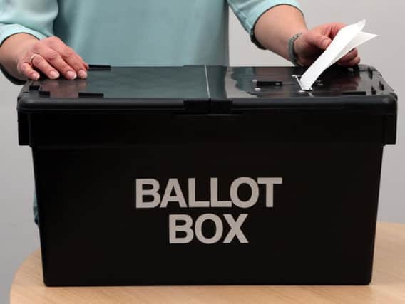 Residents cast their votes in yesterday's by-election