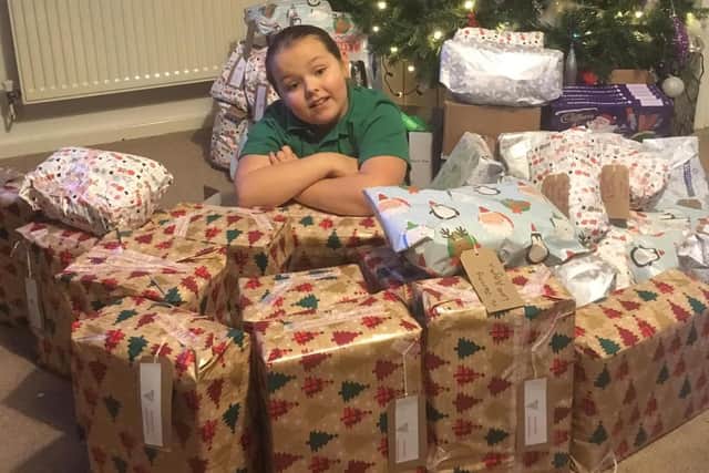 Anya pictured after wrapping up presents for the homeless.