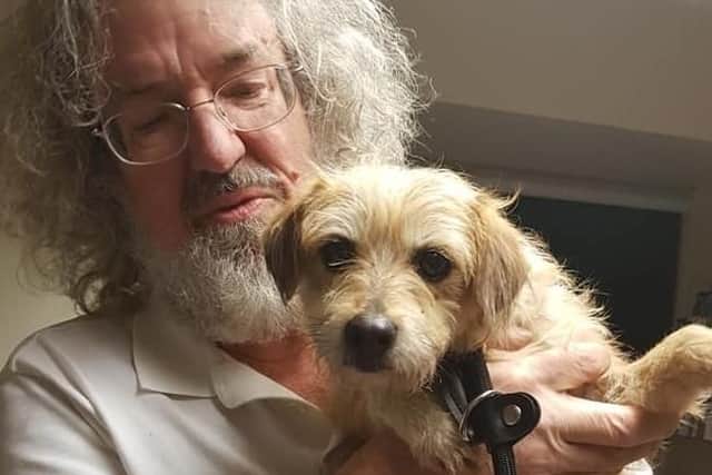 The terrier with David Joyce, a member of Milton Keynes dog squad, who was the first to the scene when the terrier was caught.