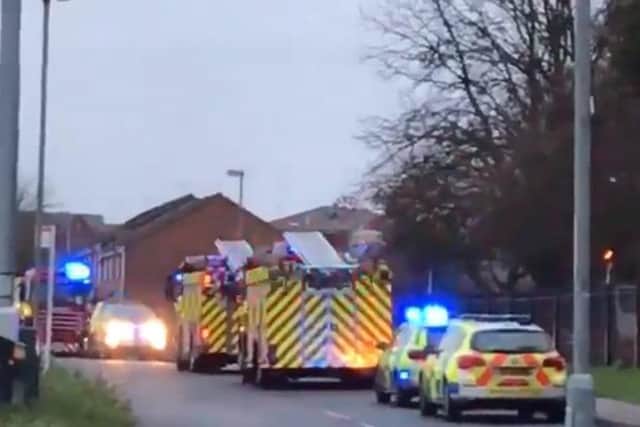 At least three fire engines are on the scene as well as several ambulances.