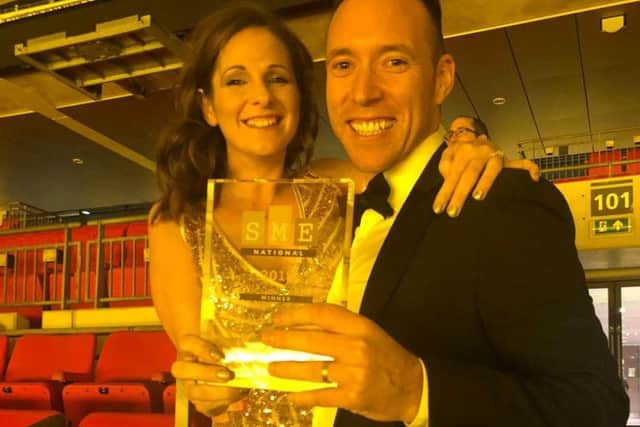 Clinic directors Richard Evans and Samantha Golden with the national award.