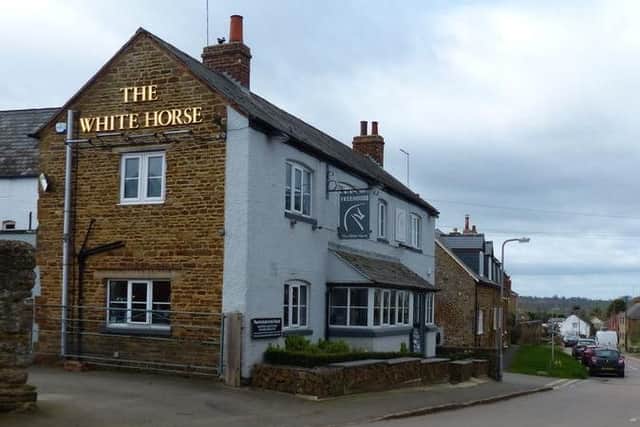 A little way out of Northampton is The White Horse. This dog-friendly rustic tavern has those classic cosy hallmarks with low ceilings, wooden floors and an open brick fireplace.