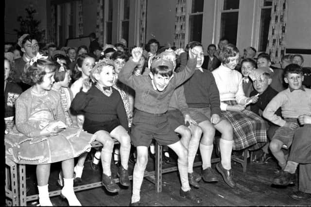 Pupils of St James Infants School, Northampton, having a fantastic time at their Christmas party on December 18, 1957