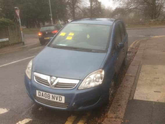 A blue Vauxhall Zafira has been parked on double-yellow lines for three months in a Northampton neighbourhood.
