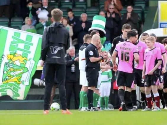 GUARD OF HONOUR: Cobblers were applauded onto the field the last time they played at Huish Park.