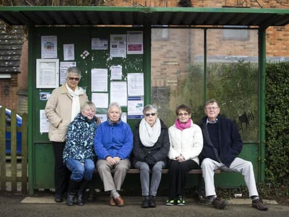 Elizabeth Packer, third from the left, has been awarded in the Queen's New Year Honours list. The Cogenhoe parish councillor was instrumental in providing a replacement to the village bus service when the county council cut subsidies to less travelled routes in the county earlier in 2018.