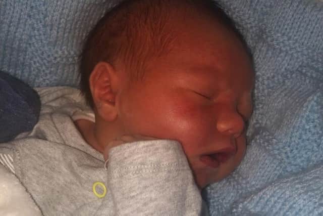 Tiny Harry was born one week early and surprised his mum and dad on Christmas Day.