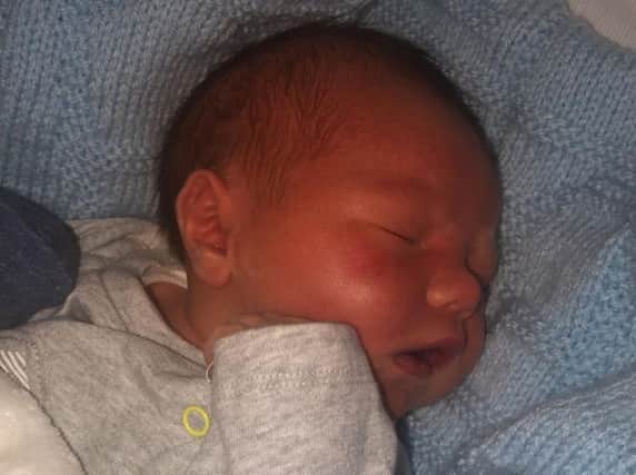 Tiny Harry was born one week early and surprised his mum and dad on Christmas Day.