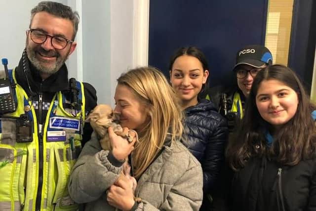 Cheers all round for Daniel Granger and his partner Katie who have their dog back home. Picture taken at the police station with Rupert's founders before the dog was taken home.