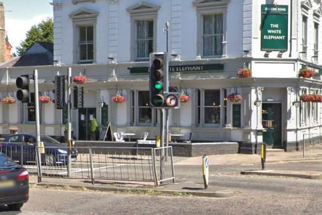 A group of youths on pedal bikes attacked a motorcyclist at a set of traffic light in Northampton.
