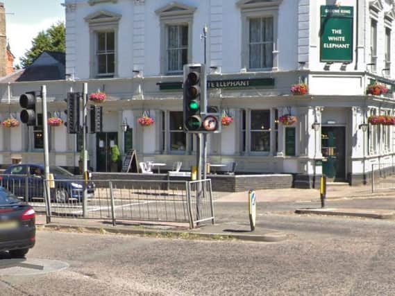 A group of youths on pedal bikes attacked a motorcyclist at a set of traffic light in Northampton.