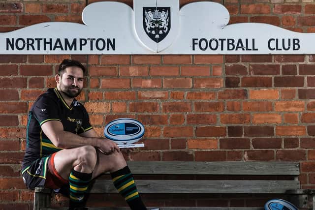 Cobus Reinach posed for pictures at Franklin's Gardens after claiming the player of the month prize for December