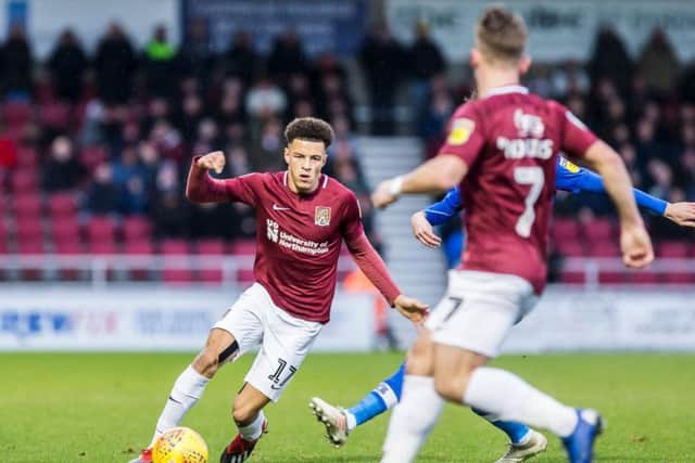 Shaun McWilliams plays a ball down the line during the Cobblers' clash with Carlisle United