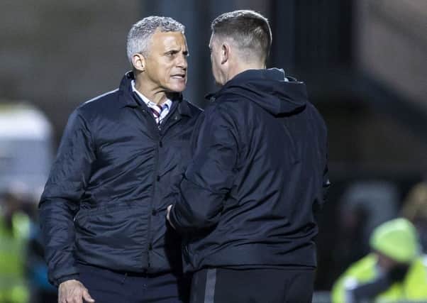Cobblers boss Keith Curle and assistant Colin West
