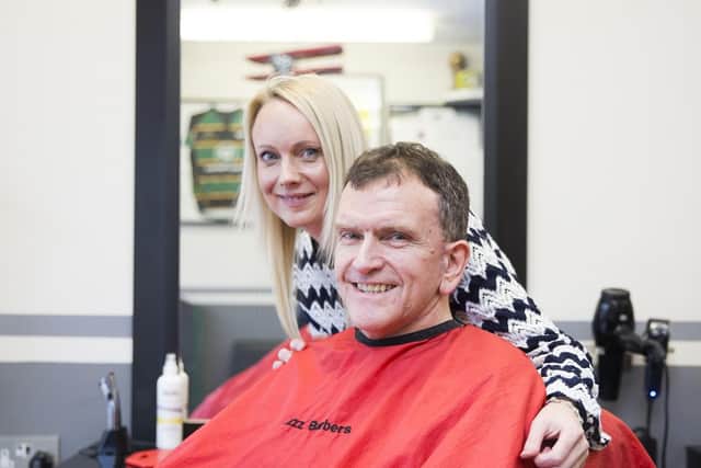 Erinna and Adam pictured at Jazz Hairdressing after she gave advice about his mole, which saved his life. Credit: Kirsty Edmonds.