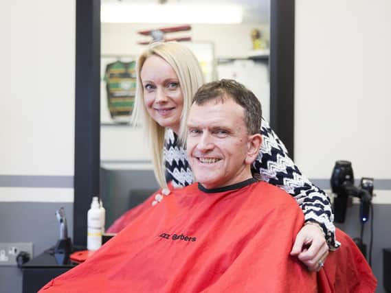 Erinna and Adam pictured at Jazz Hairdressing after she gave advice about his mole, which saved his life. Credit: Kirsty Edmonds.