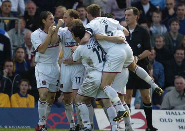 The Cobblers players celebrate Martin Smith's goal in the division three play-off semi-final at Mansfield in 2004