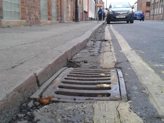 One of the gully covers, in Overstone Road, The Mounts, has been replaced