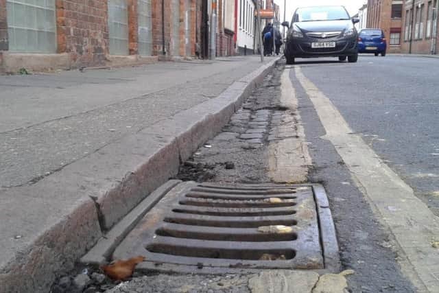 One of the gully covers, in Overstone Road, The Mounts, has been replaced