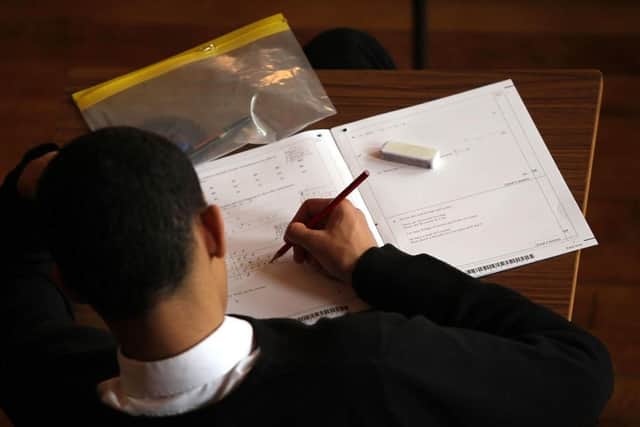 teen sitting exam
