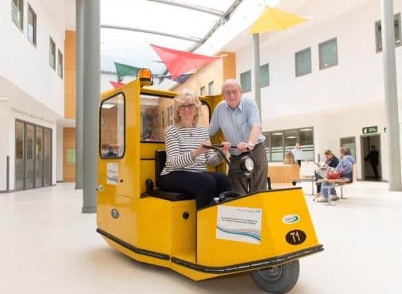 Pictured volunteers at Peterborough Hospital on a replica buggy, which NGH is fundraising for. NGH would, however, like their buggy to be white and will brand it with the fundraisers names.